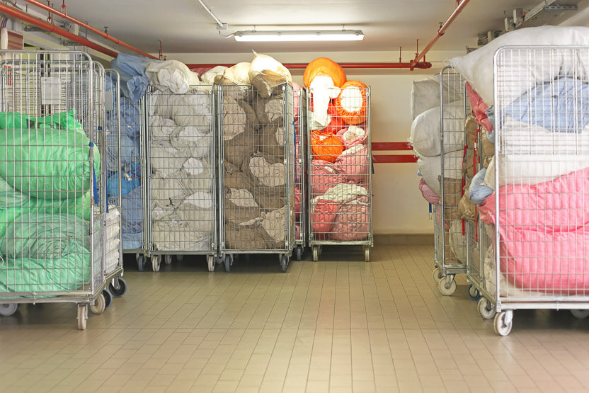 Verwendung von Rollbehältern als Wäschekorb in Krankenhäusern